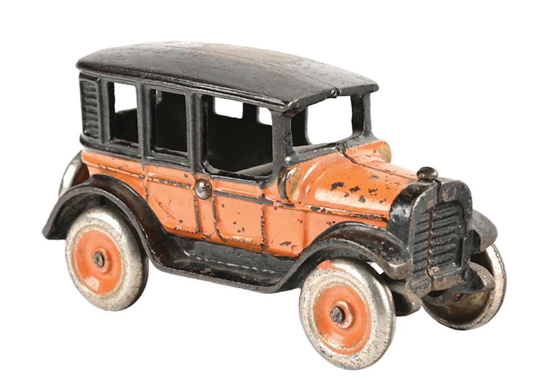 ARCADE CAST IRON ORANGE SEDAN