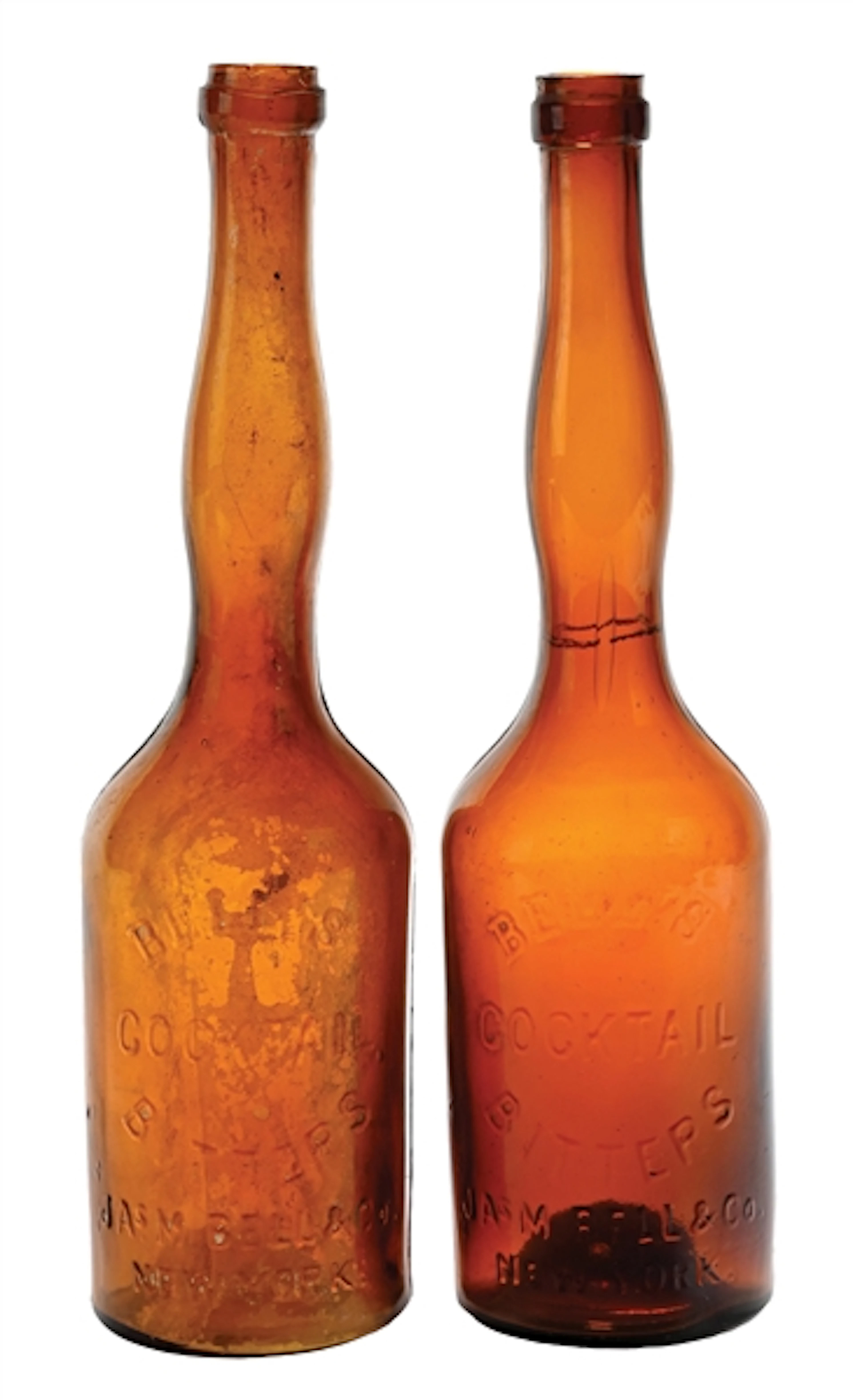 LOT OF 2: EMBOSSED BELL'S COCKTAIL BITTERS LADY'S LEG-TYPE BOTTLES