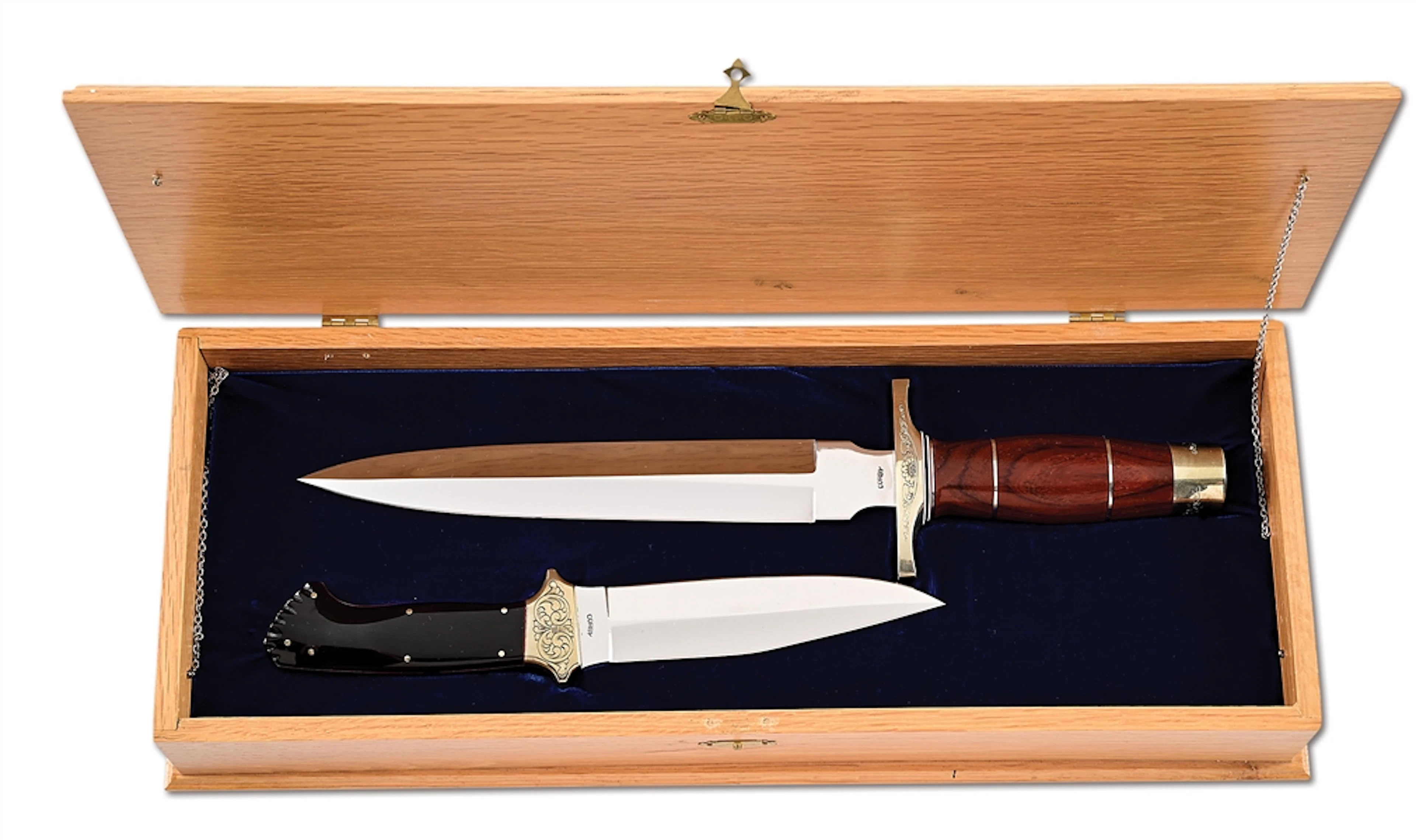 CASED SET OF HAROLD CORBY KNIVES.