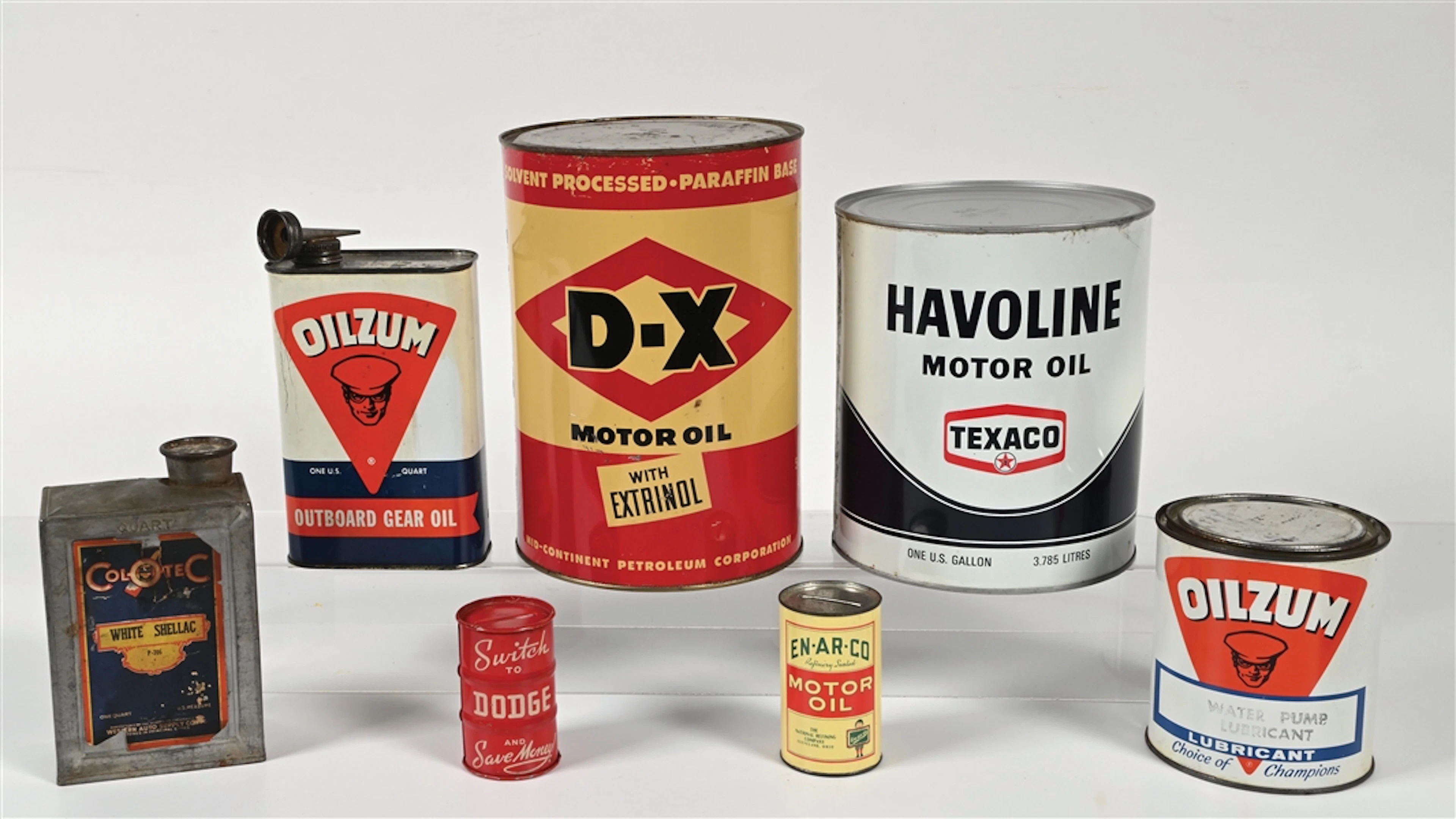 COLLECTION OF 7: ASSORTED MOTOR OIL CANS & COIN BANKS.