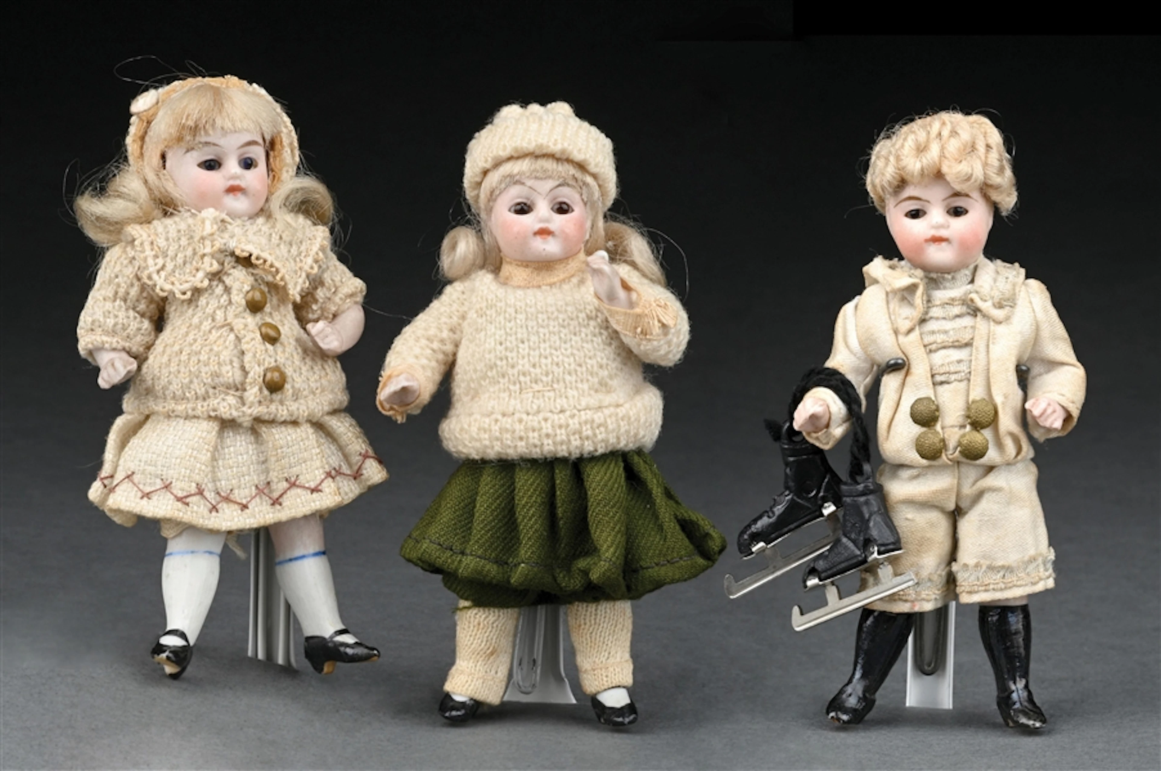 LOT OF 3: SIMILAR ALL BISQUE DOLLS EACH DRESSED IN WINTER GARB