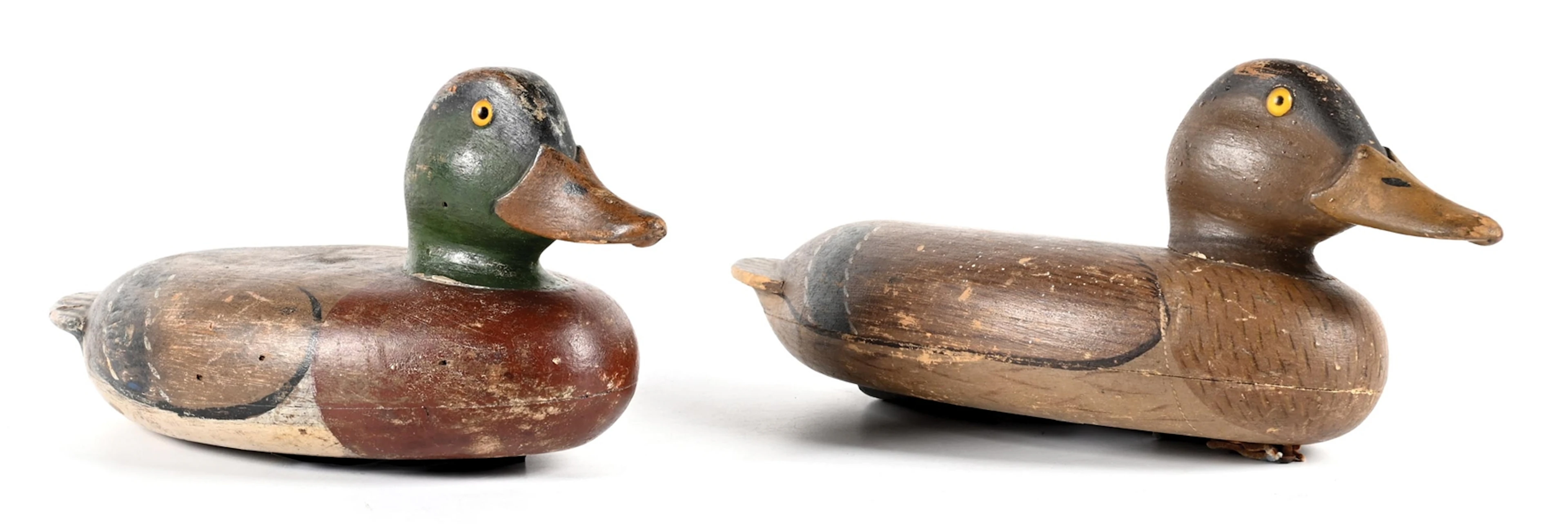 A PAIR OF VINTAGE WOODEN DUCK DECOYS