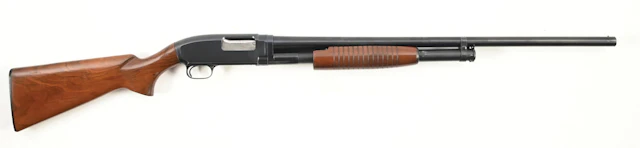 (C) WINCHESTER MODEL 12 SLIDE ACTION SHOTGUN.