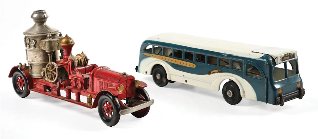 LOT OF 2: KENTON CAST IRON PUMPER FIRE TRUCK & BUDDY "L" WIND-UP GREYHOUND BUS