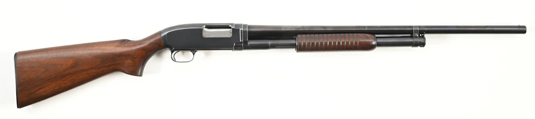 (C) WINCHESTER MODEL 12 SLIDE ACTION SHOTGUN.
