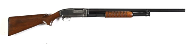 (C) PRE-WAR WINCHESTER MODEL 12 SLIDE ACTION SHOTGUN.