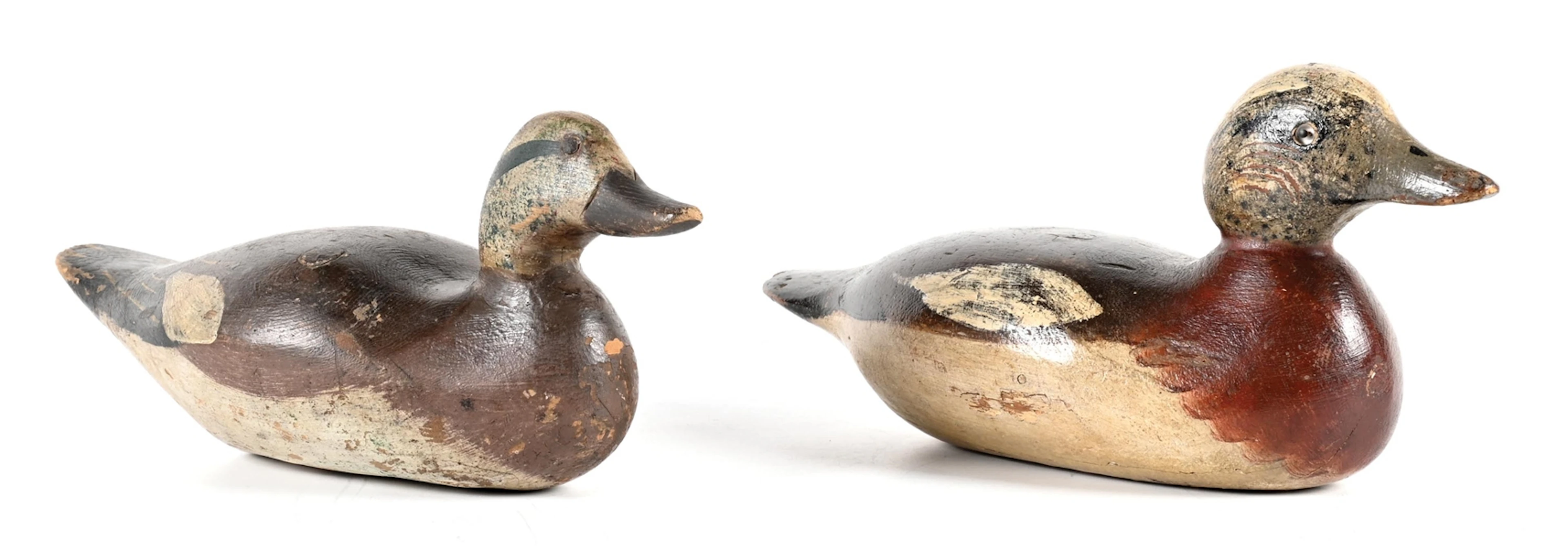 A PAIR OF VINTAGE WOODEN DUCK DECOYS