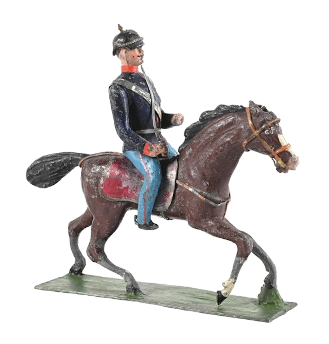 GERMAN MANUFACTURER GERMAN CAVALRY OFFICER IN PICKELHAUBE ON GALLOPING HORSE