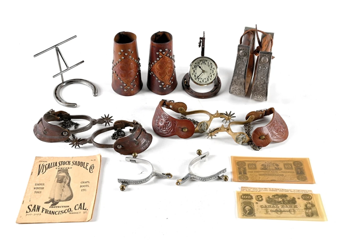 LOT OF 9: VARIOUS SPURS, CUFFS, HORSESHOE CLOCK, LITERATURE AND TWO