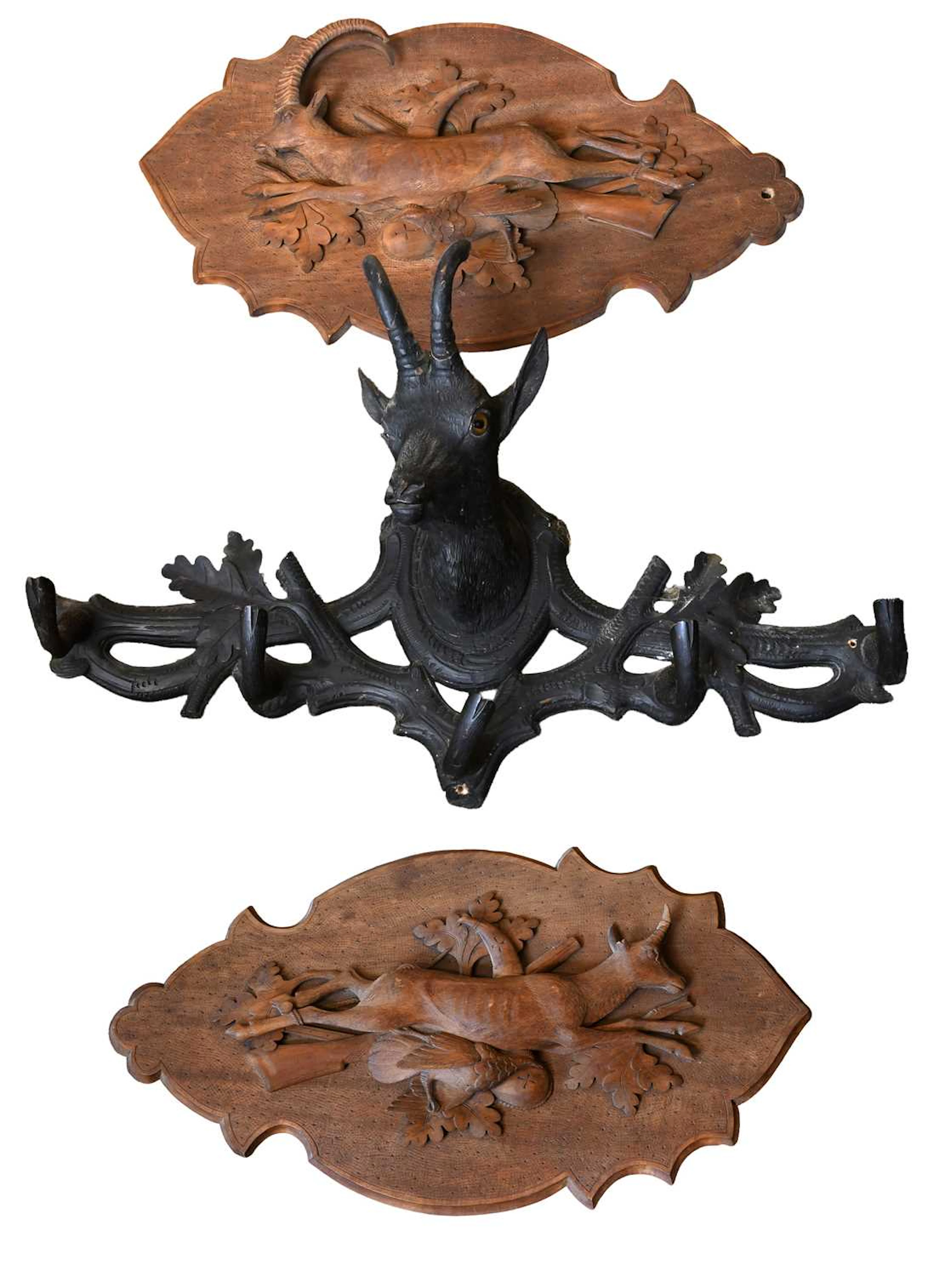 A Black Forest Carved and Ebonised Five Hook Coat Rack