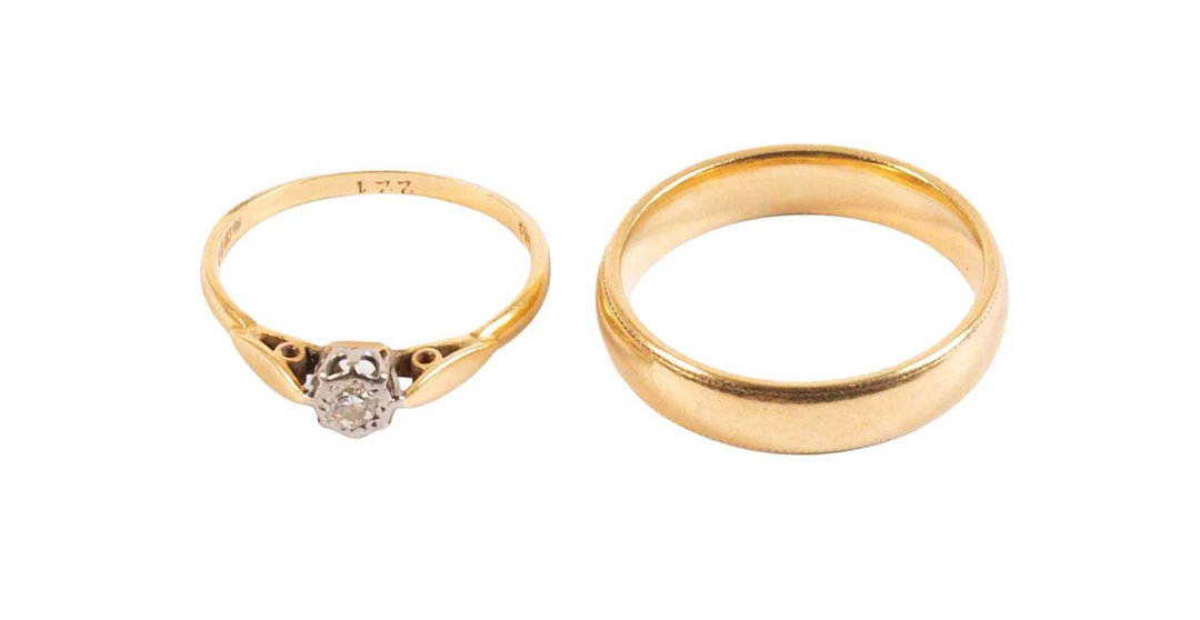 An 18 Carat Gold Band Ring, An 18 Carat Gold Diamond Solitaire Ring
