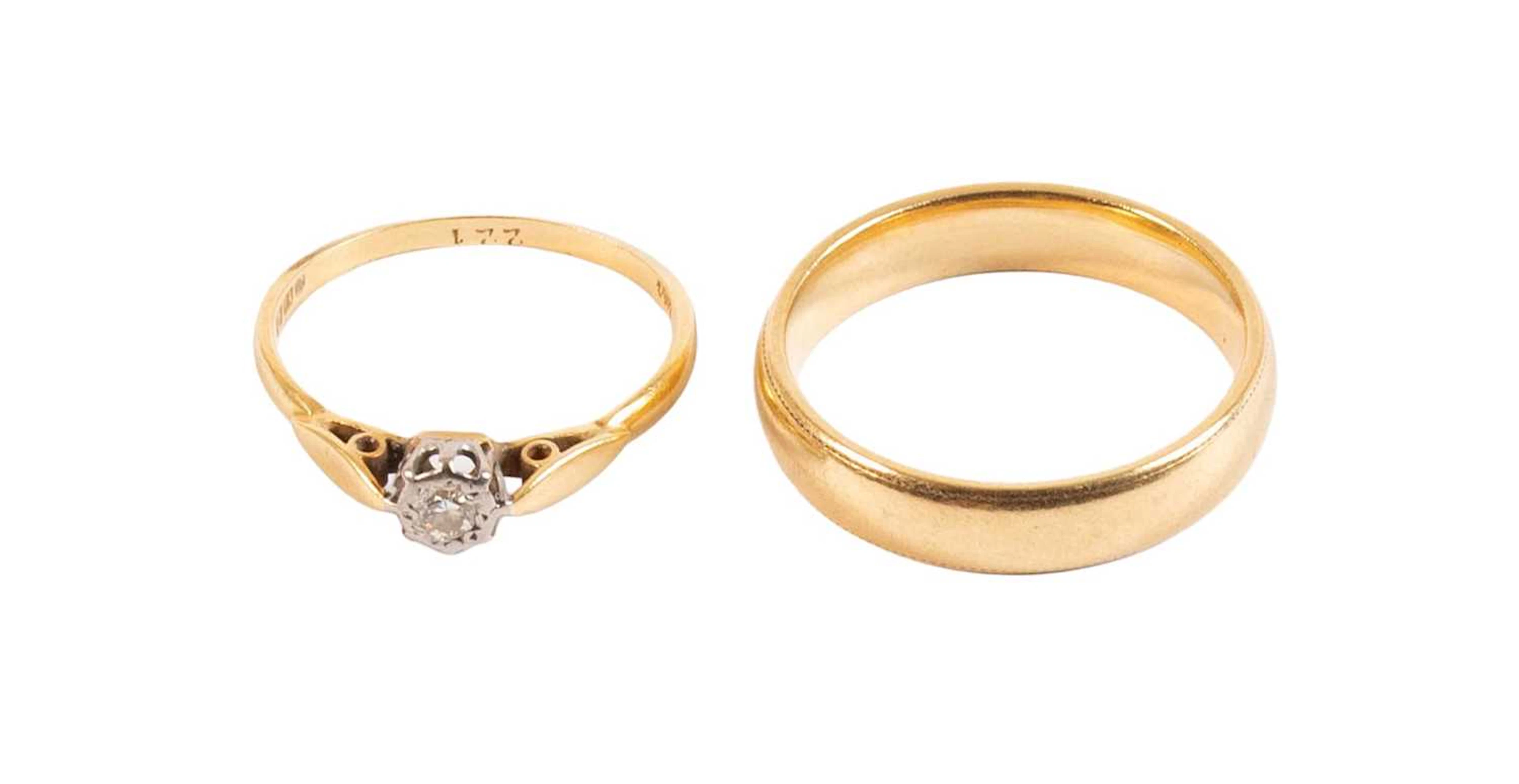 An 18 Carat Gold Band Ring, An 18 Carat Gold Diamond Solitaire Ring