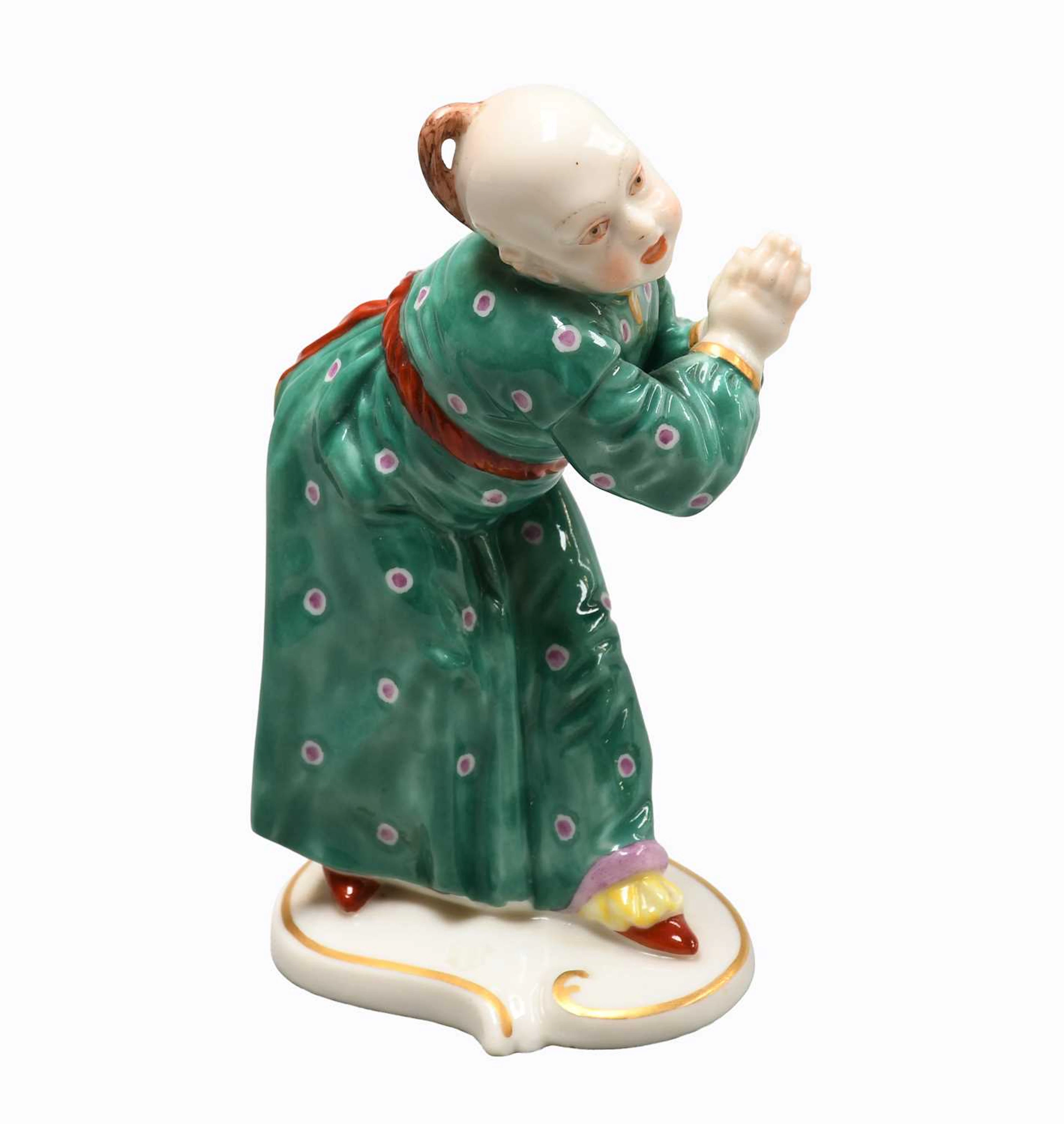A Nymphenburg Chinoiserie Porcelain Figure of a Boy, 19th Century