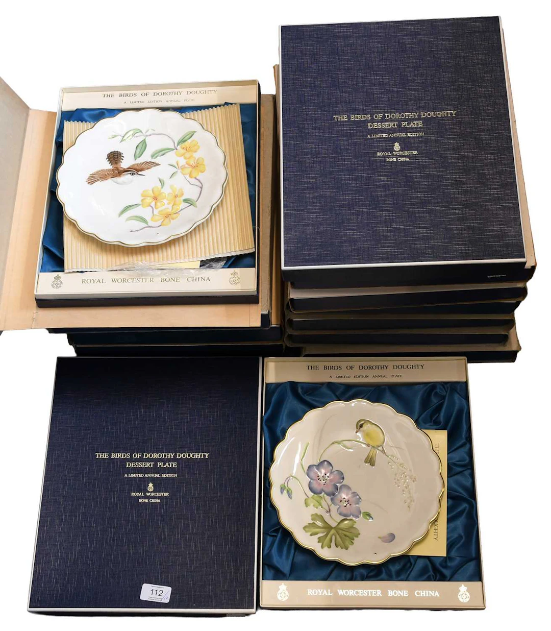 A Set of Twelve Royal Worcester Annual Dessert Plates "The Birds of