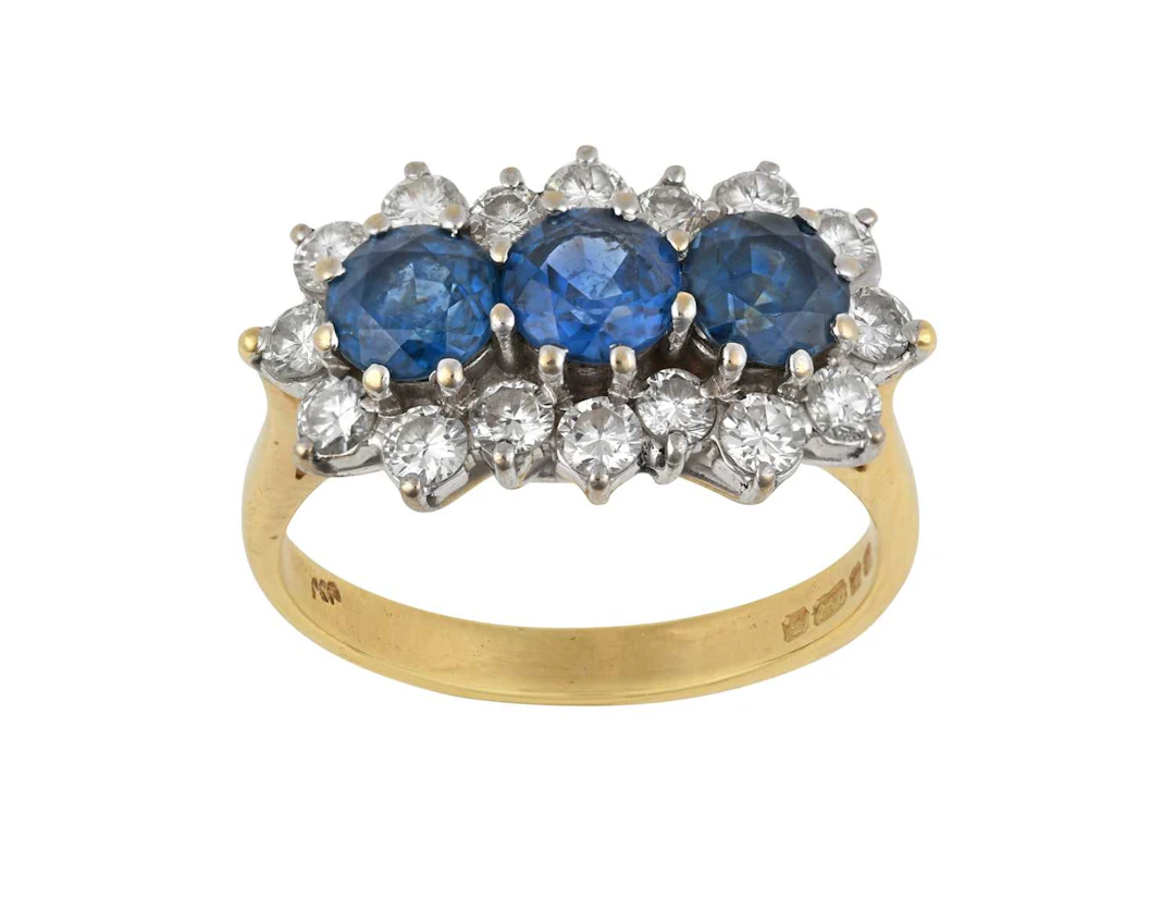 An 18 Carat Gold Sapphire and Diamond Triple Cluster Ring