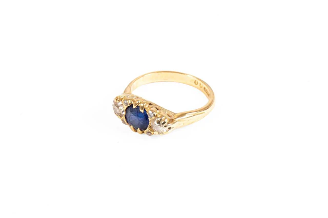 An 18 Carat Gold Blue Stone and Diamond Ring