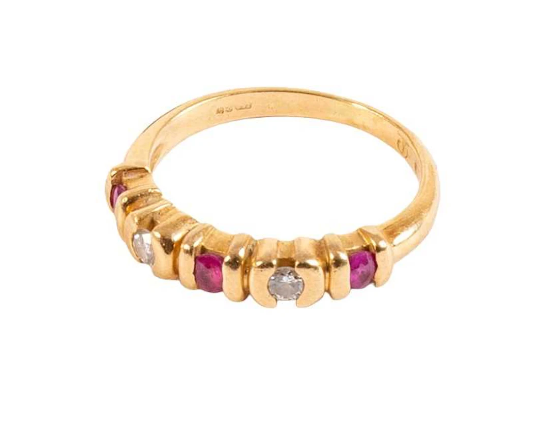 An 18 Carat Gold Ruby and Diamond Five Stone Ring