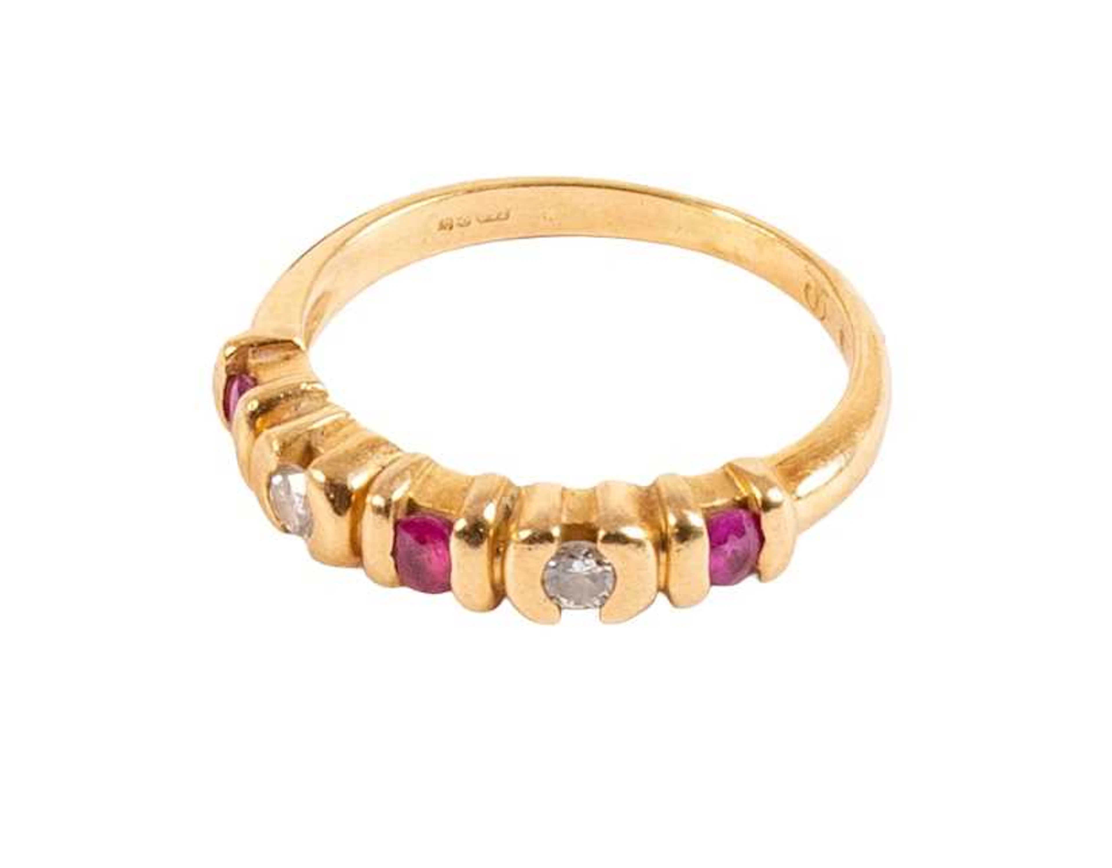 An 18 Carat Gold Ruby and Diamond Five Stone Ring