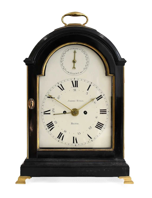 An Ebonised Striking Calendar Table Clock, signed James Evill, Bath
