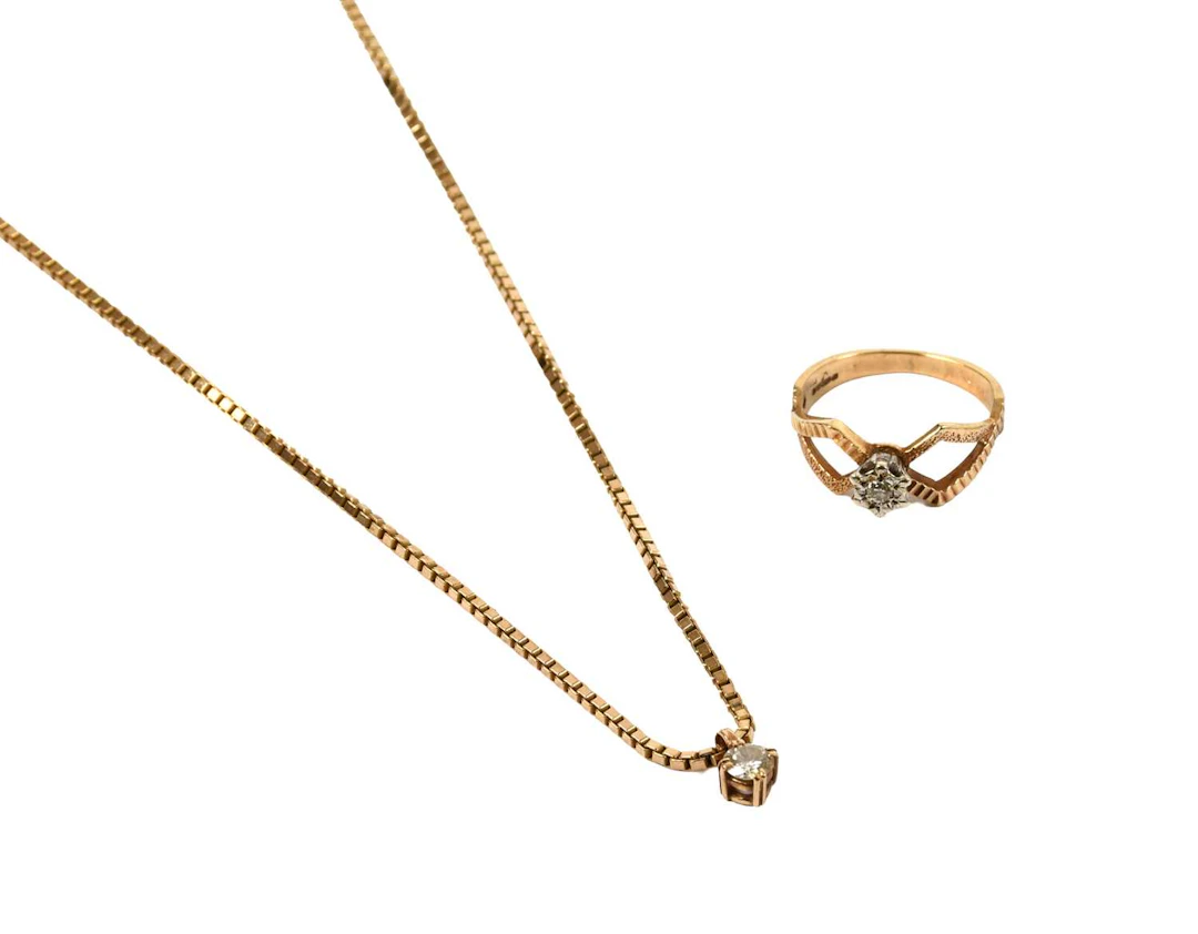 A 9 Carat Gold Diamond Solitaire Ring, A Diamond Solitaire Pendant on Chain