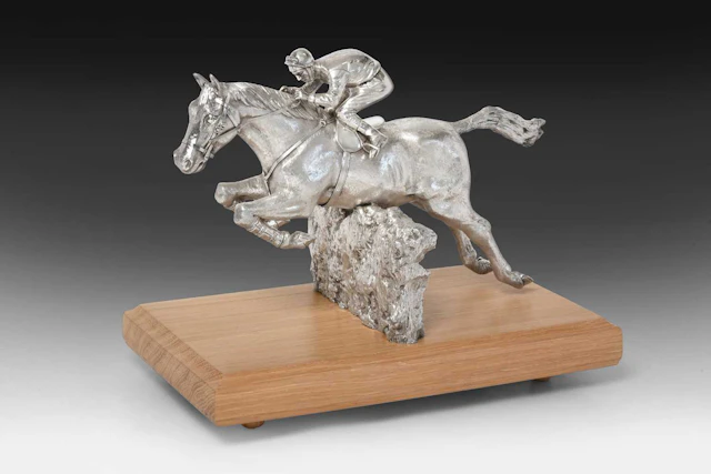 An Elizabeth II Silver Model of a Horse and Jockey by Garrard and