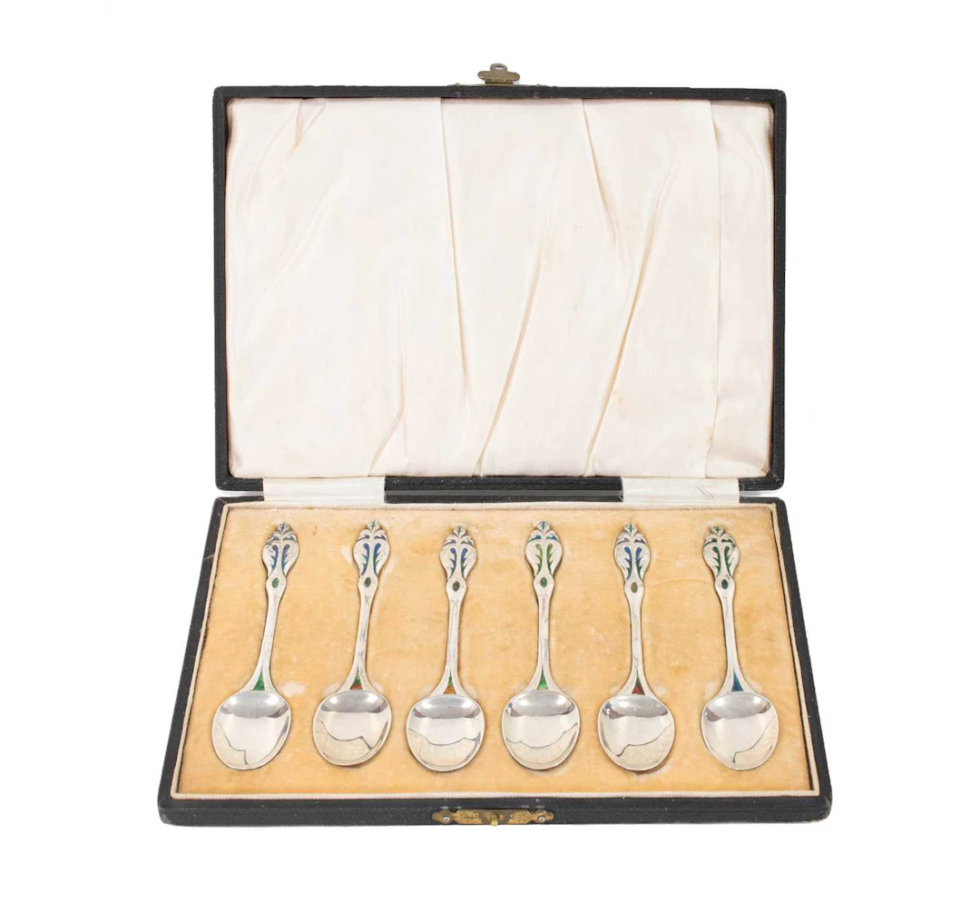 A Set of Six Liberty & Co., Silver and Enamel Coffee Spoons