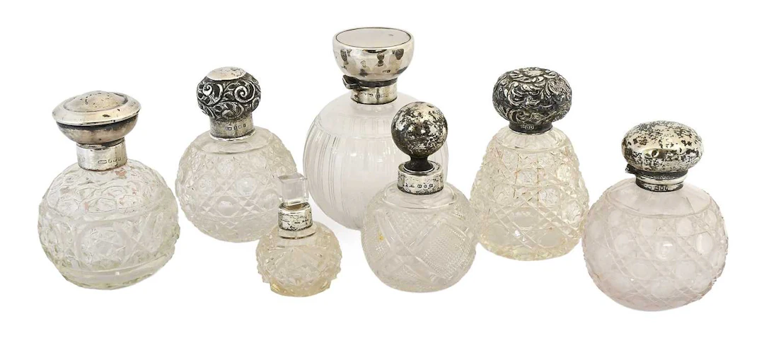 A Collection of Assorted Silver-Mounted Cut or Engraved Glass Scent-Bottles