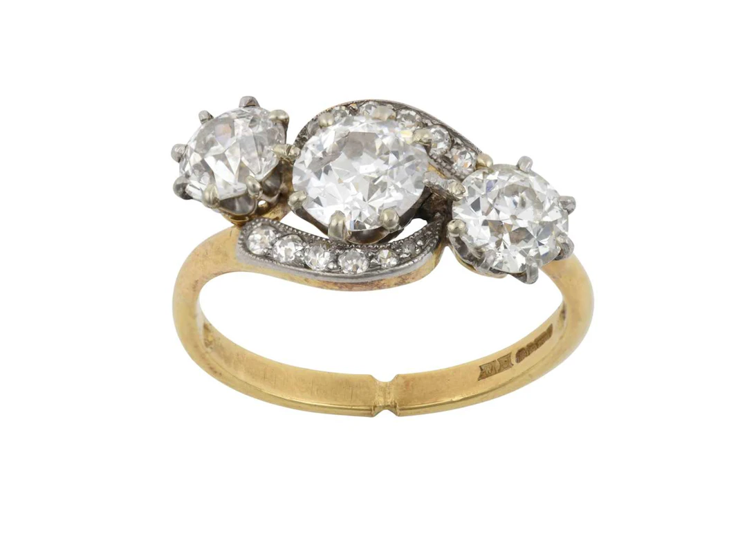 An 18 Carat Gold Diamond Three Stone Twist Ring