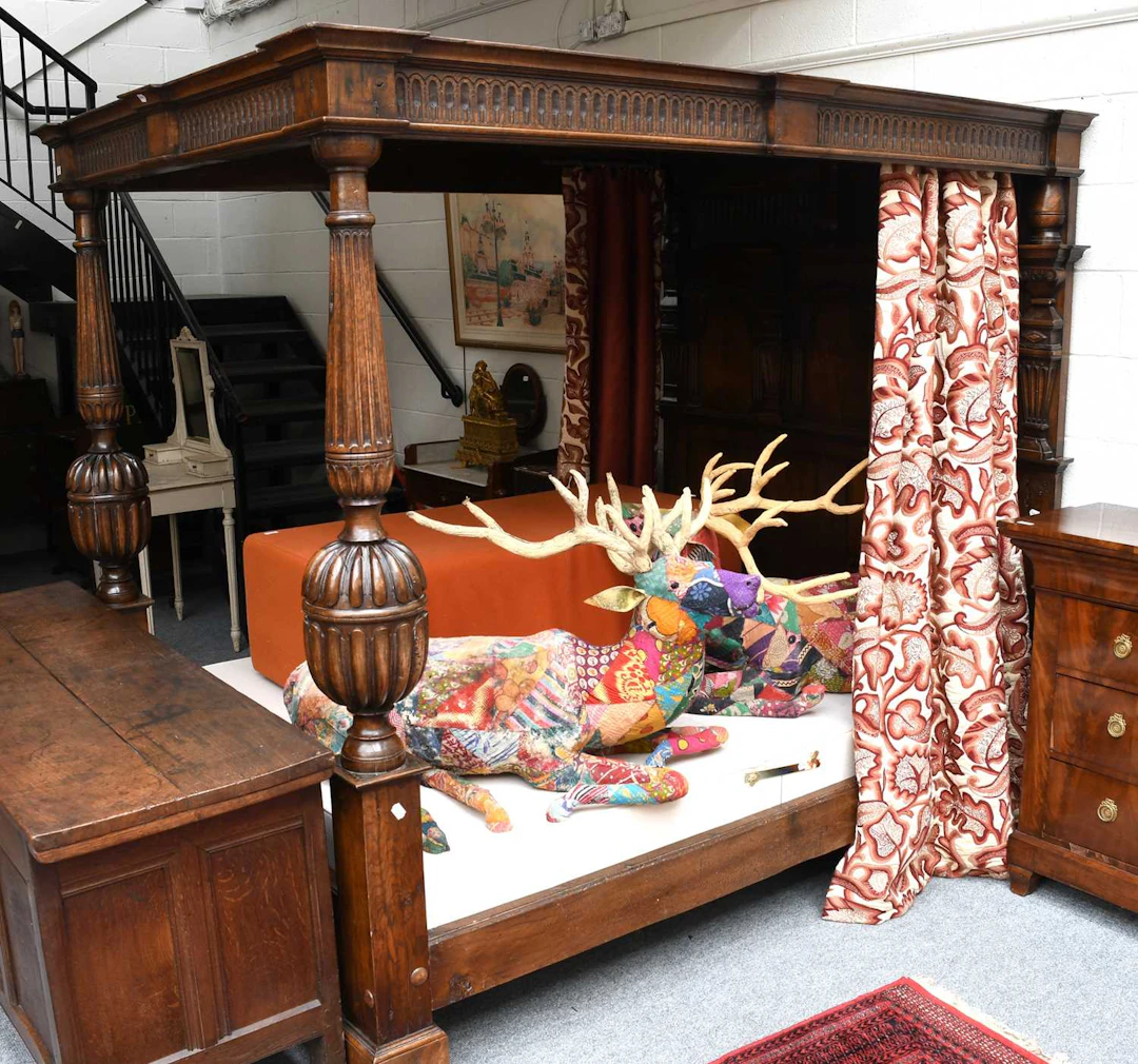 An Elizabeth I Style Carved and Panelled Four Poster Bed