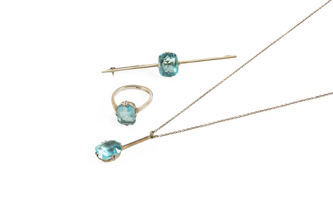 A Blue Glass Necklace, Ring and Brooch Suite