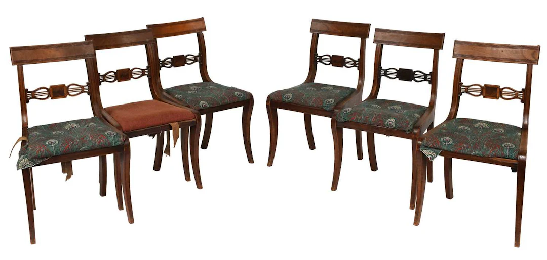A Set of Six Regency Mahogany Sabre Leg Dining Chairs