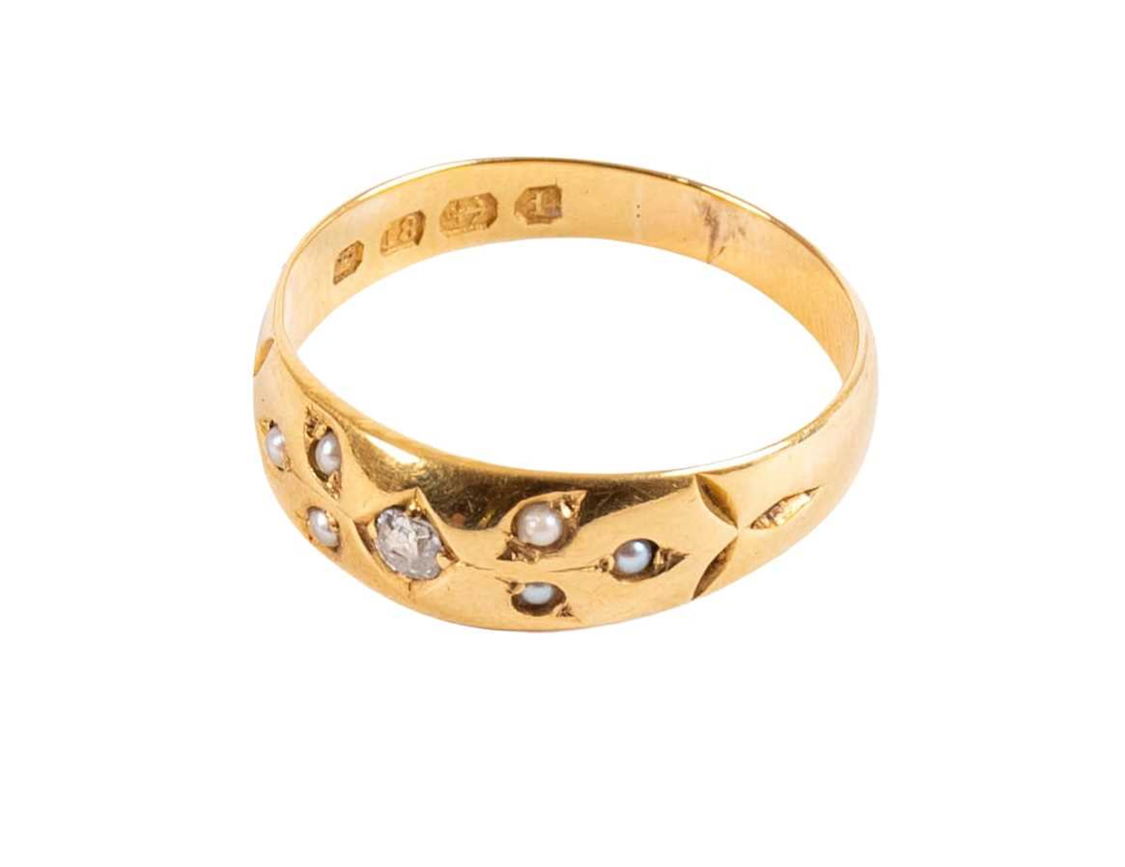 An 18 Carat Gold Seed Pearl and Diamond Ring