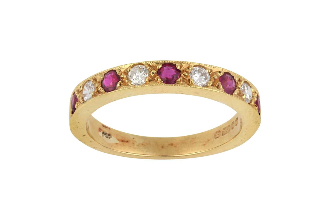 An 18 Carat Gold Ruby and Diamond Half Hoop Ring