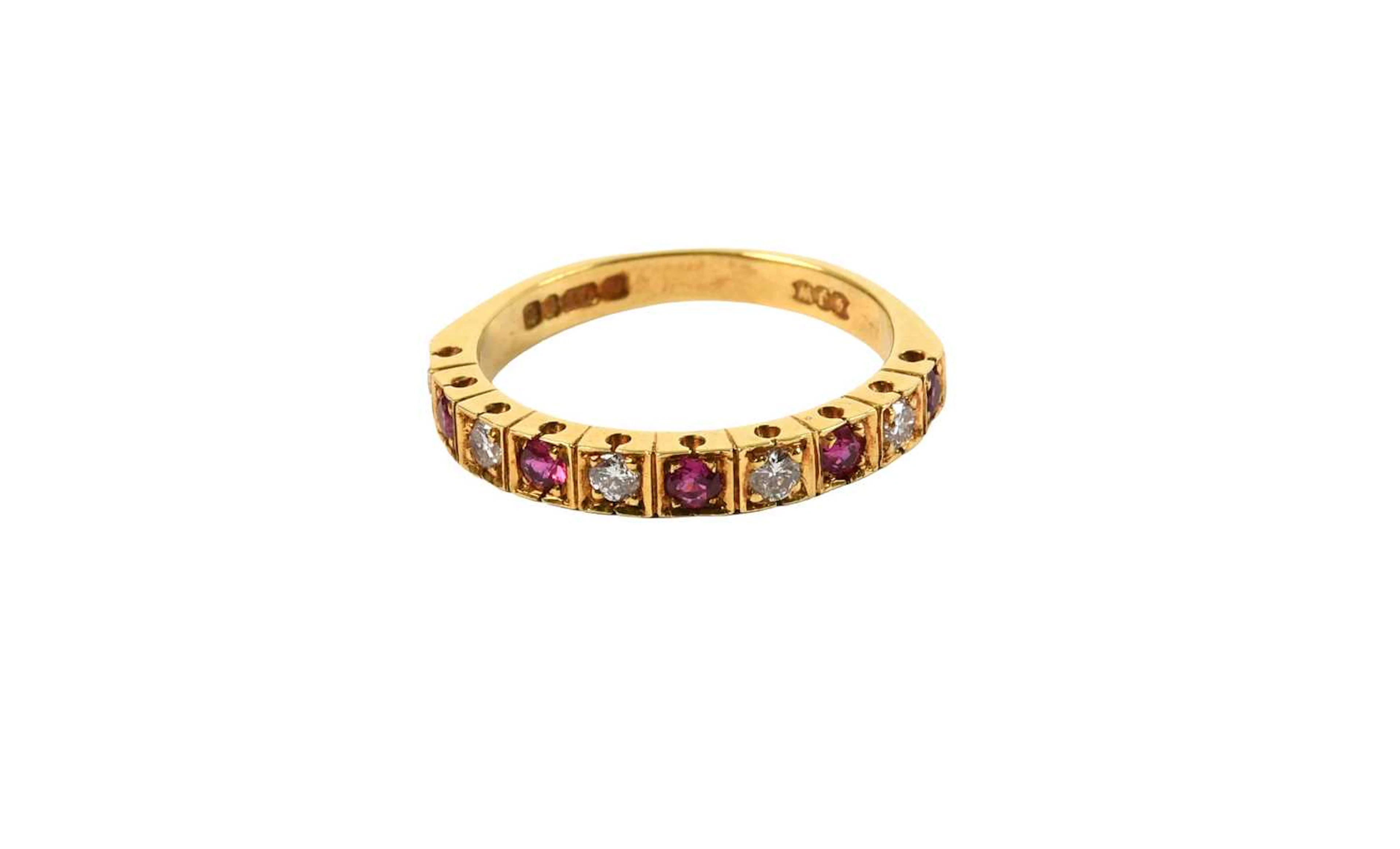 An 18 Carat Gold Ruby and Diamond Half Hoop Ring