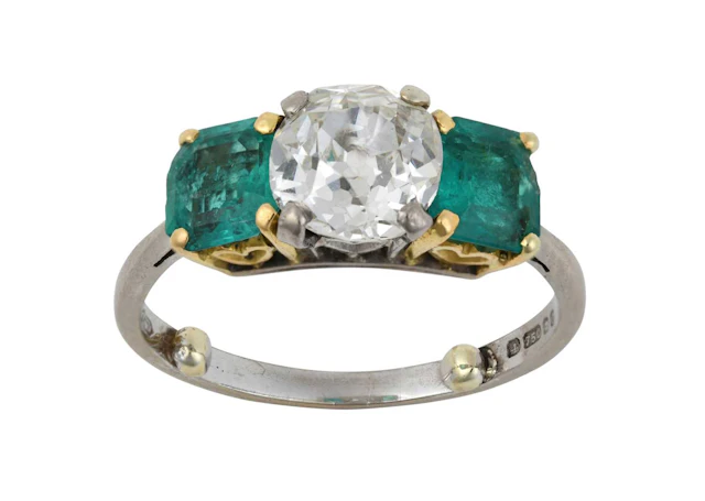 An 18 Carat Gold Diamond and Emerald Three Stone Ring