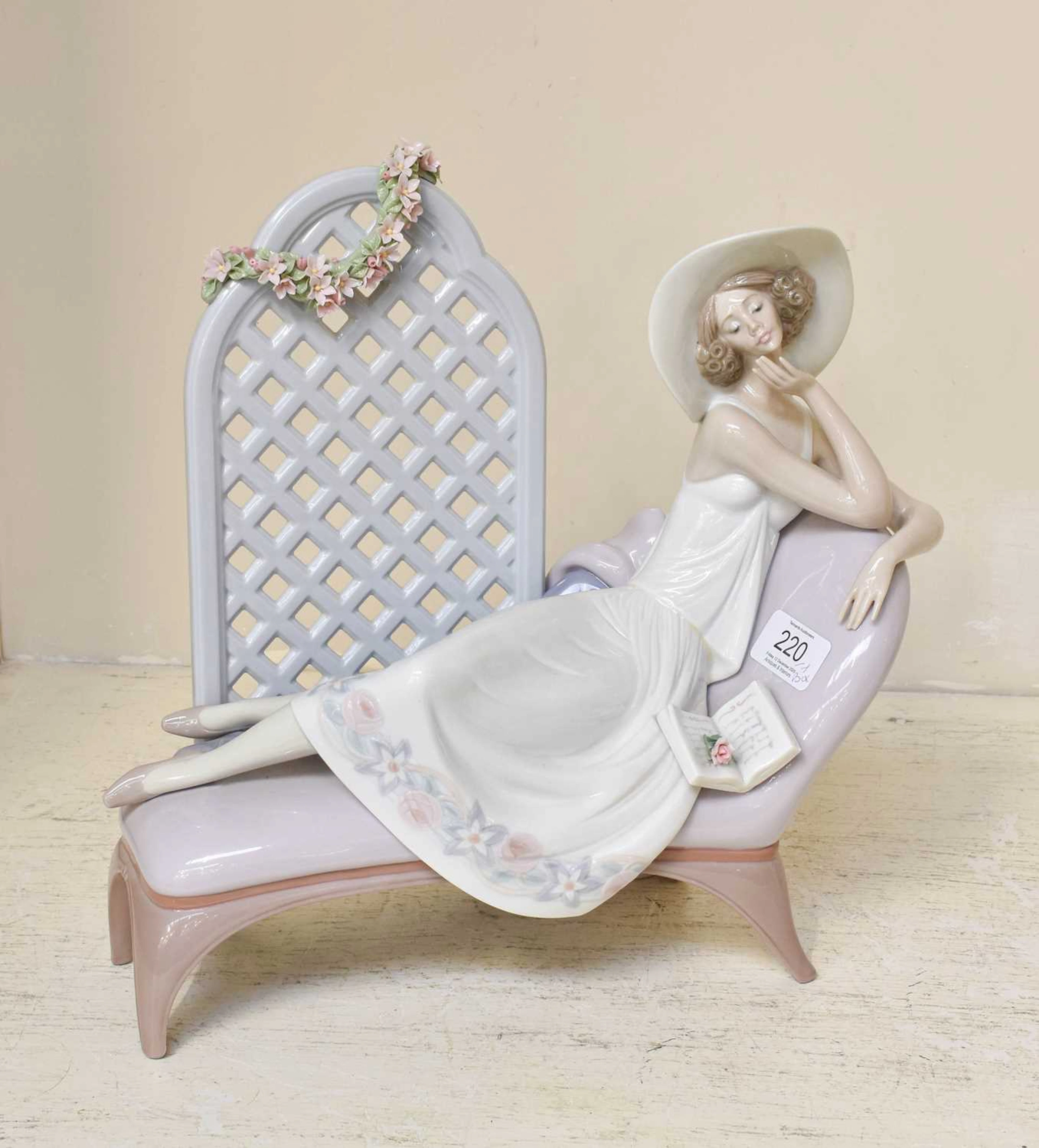 A Lladro Porcelain Figure of a Reclining Lady "Garden of Dreams"