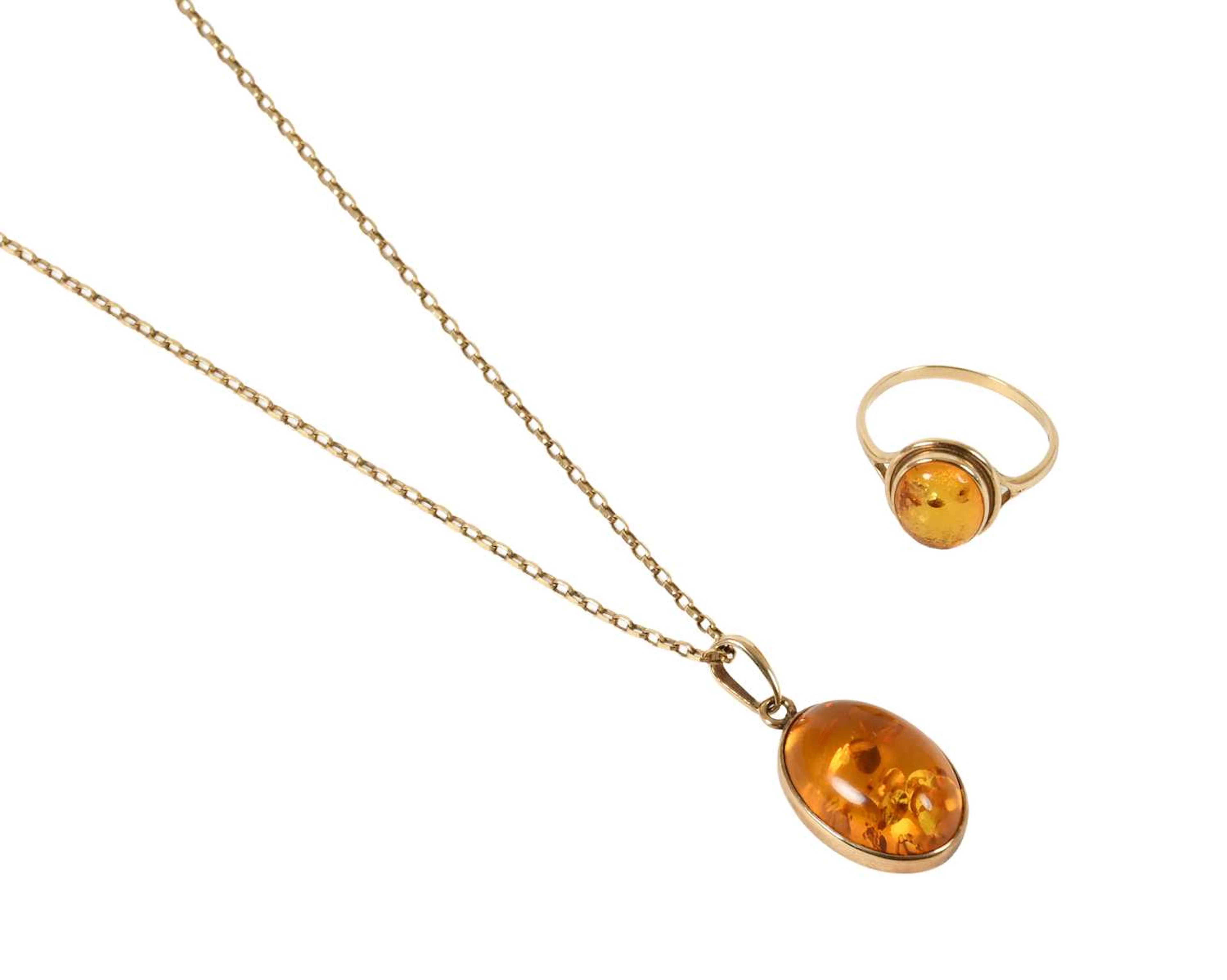 A 9 Carat Gold Amber Ring, A 9 Carat Gold Amber Pendant on Chain