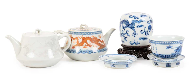 A Chinese Porcelain Bowl and Two Stands, bear Kangxi reign marks