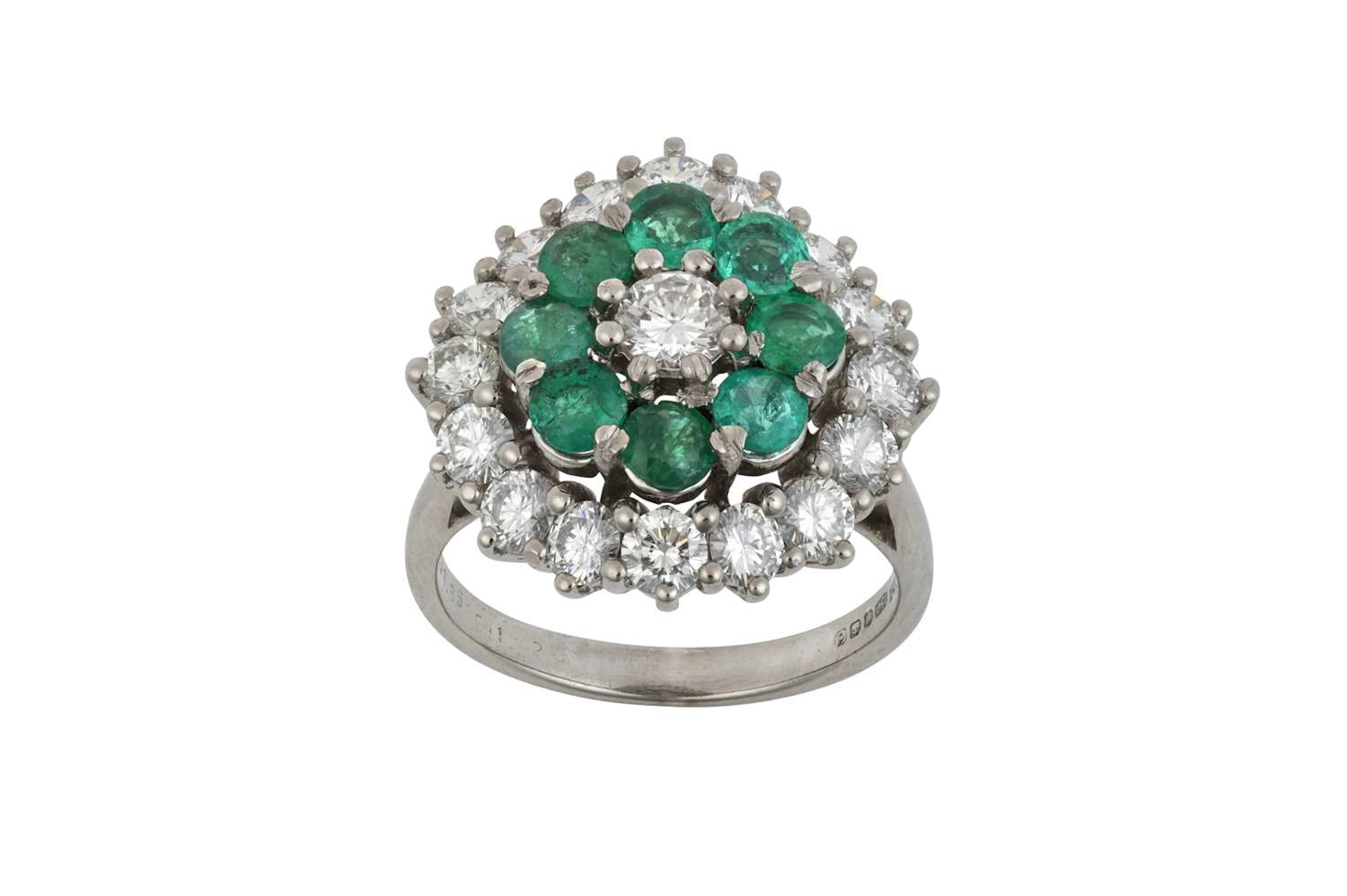 An 18 Carat White Gold Emerald and Diamond Cluster Ring