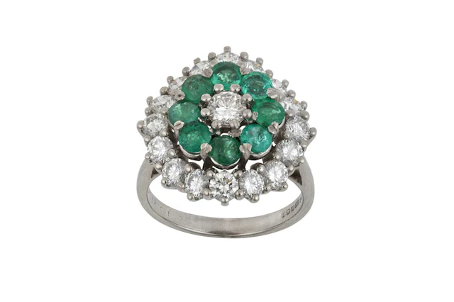 An 18 Carat White Gold Emerald and Diamond Cluster Ring