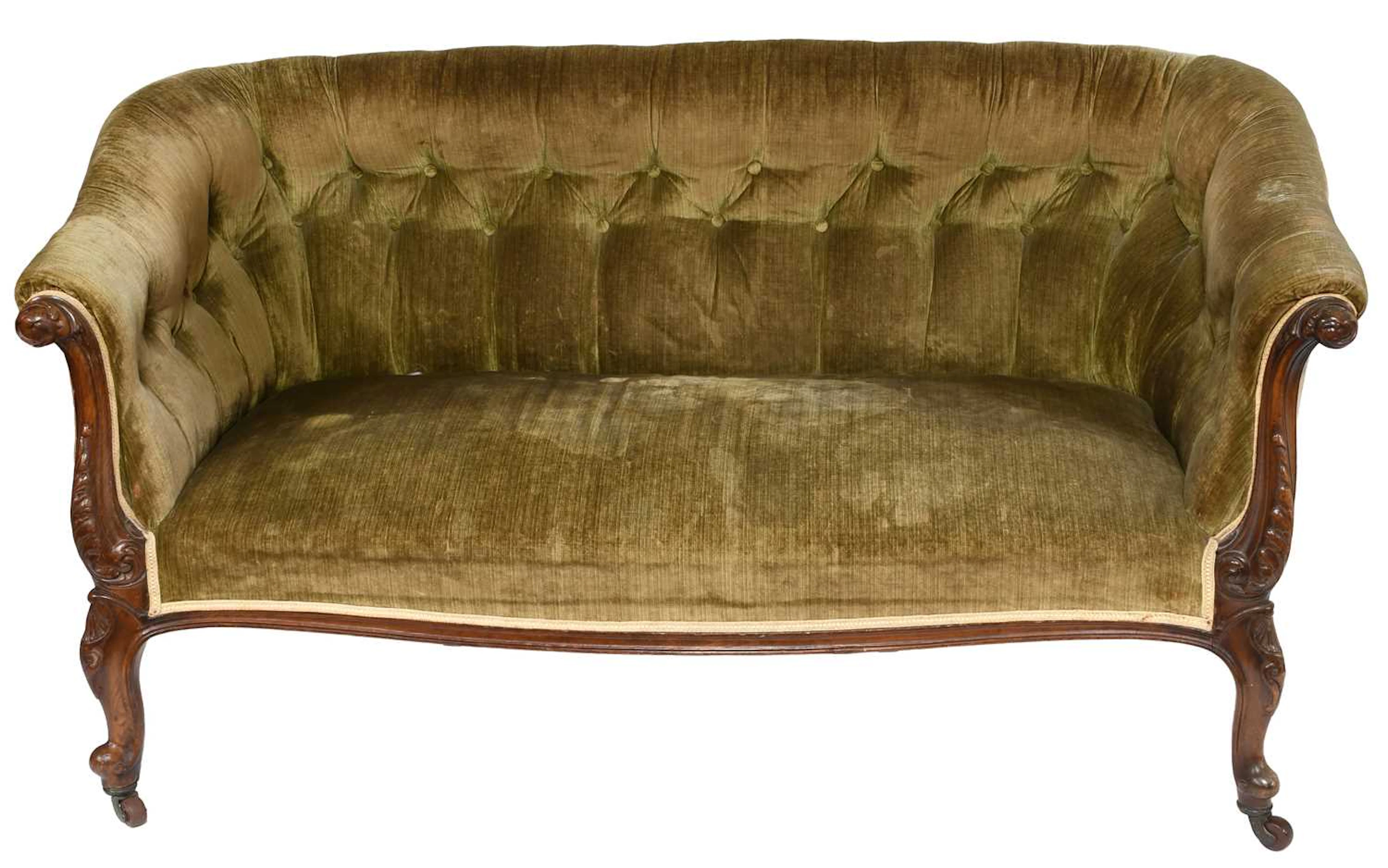 A Victorian Carved Walnut Upholstered Button Back Sofa