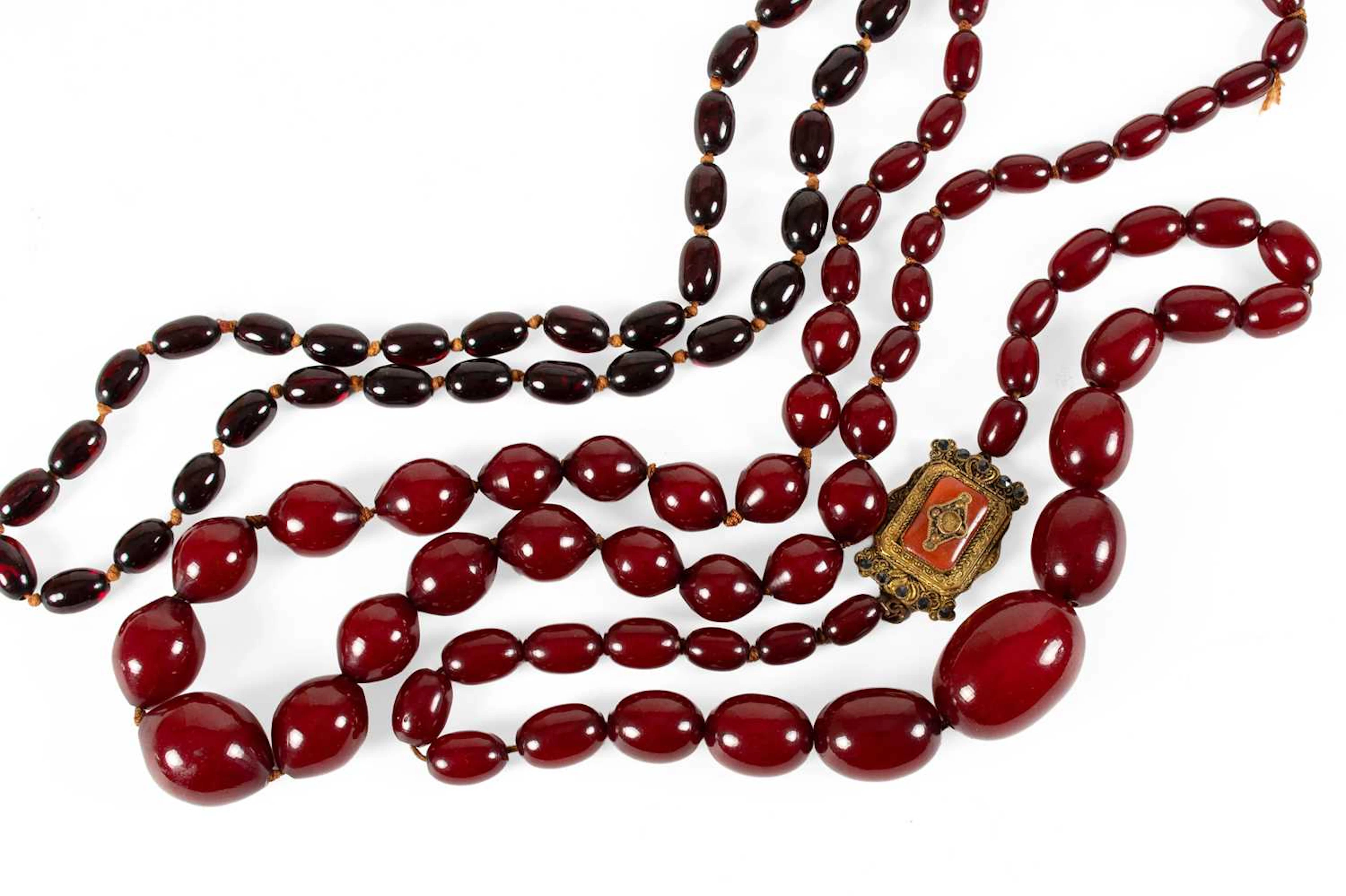 Three Imitation Amber Type Necklaces (a.f)