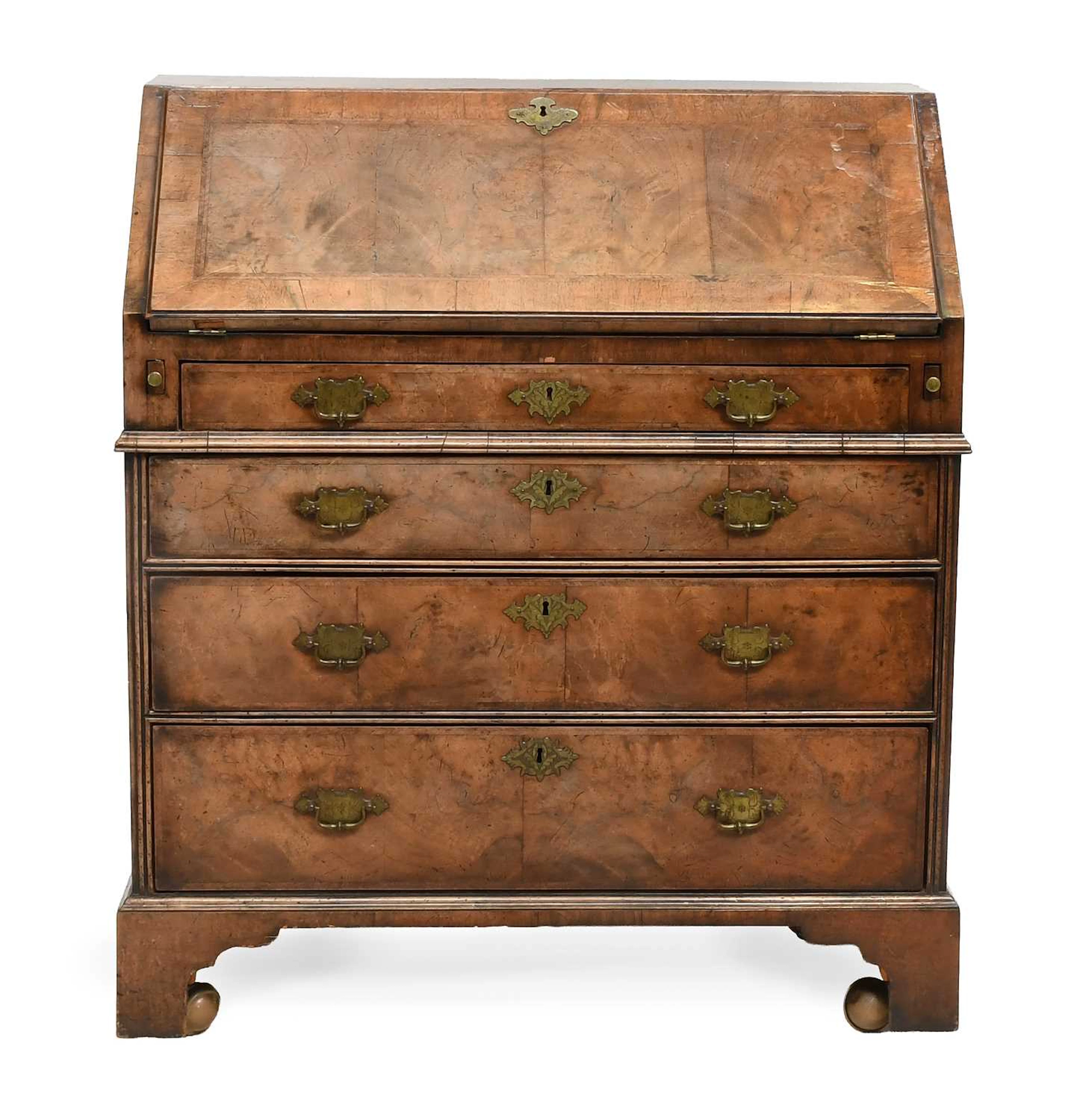 A George I Walnut, Crossbanded and Featherbanded Bureau, early 18th century
