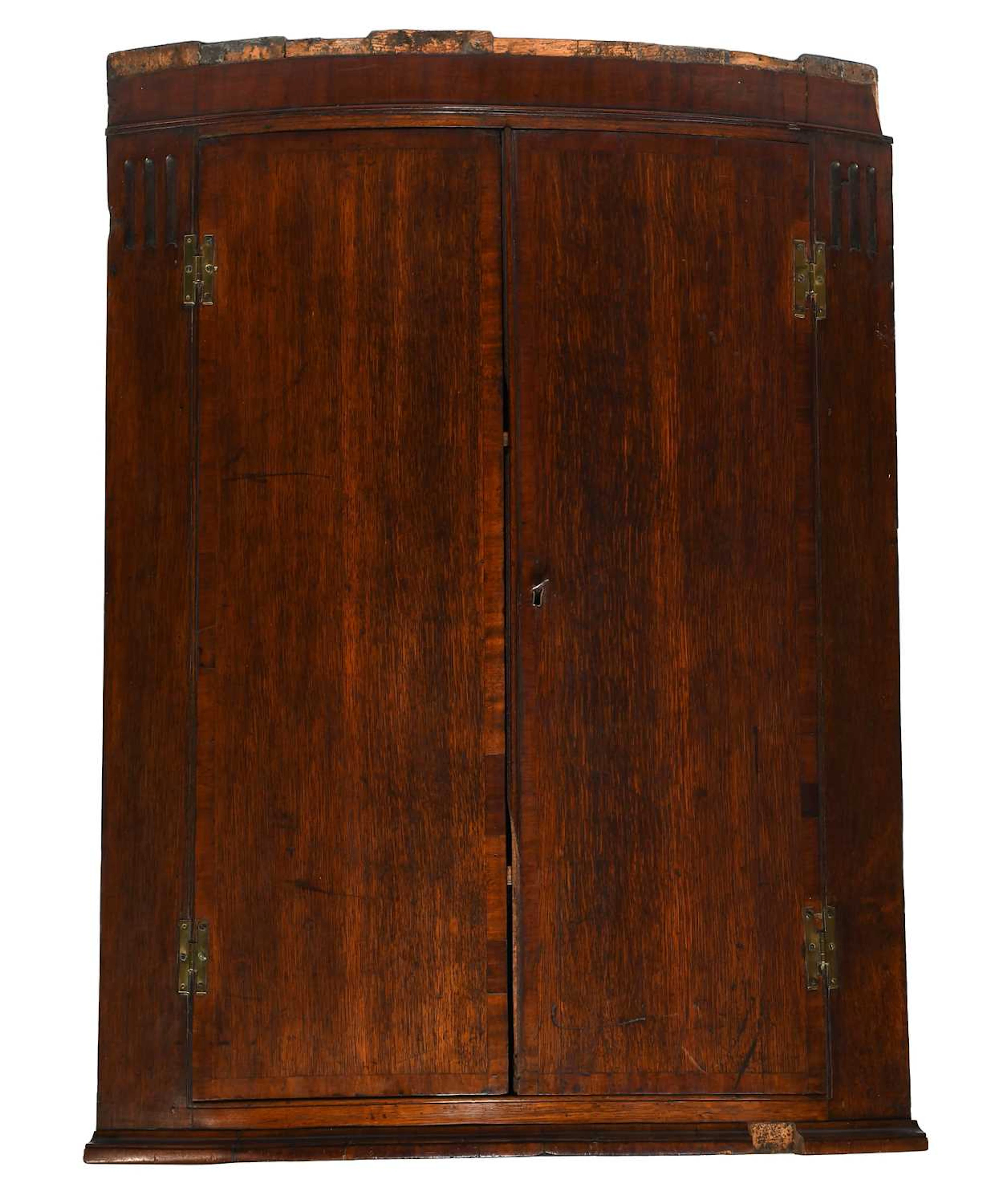 A George III Oak Bow Fronted Hanging Corner Cupboard