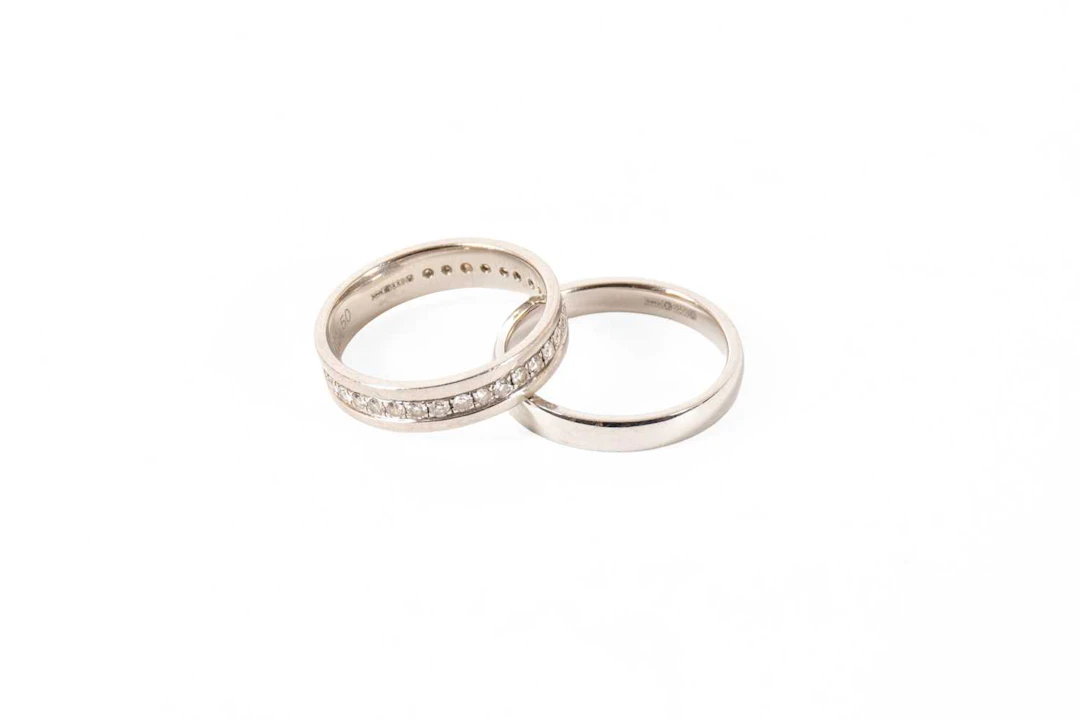 A Platinum Diamond Half Eternity Ring, A Platinum Band Ring