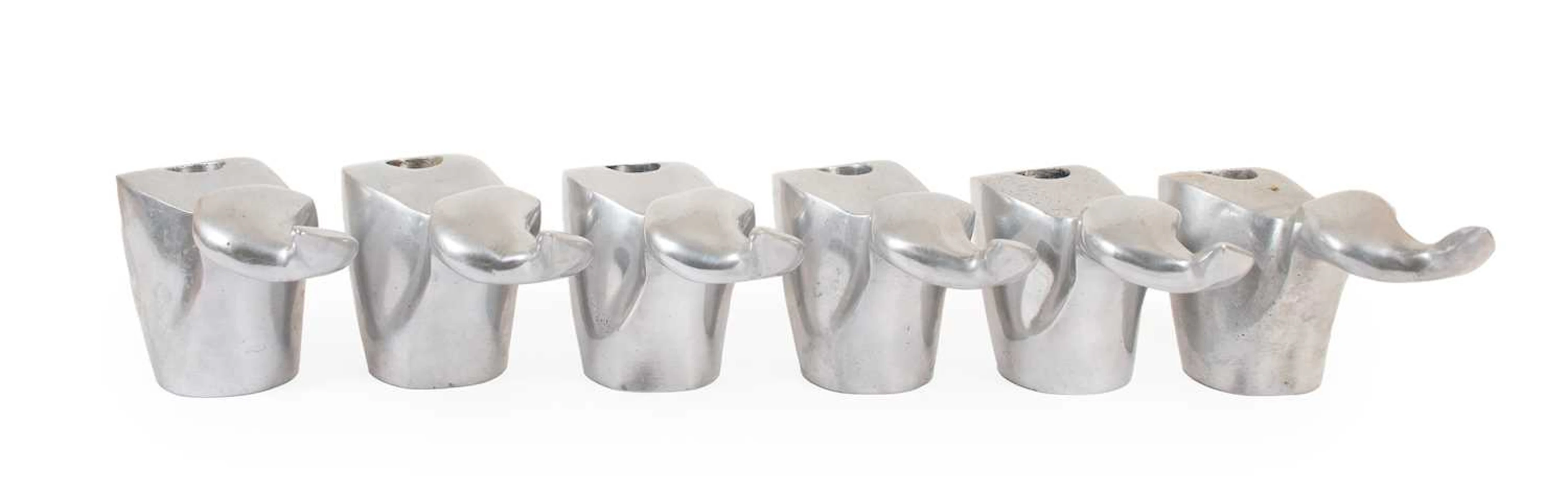 A Set of Six Philip Watts Cast Aluminium Candle Holders