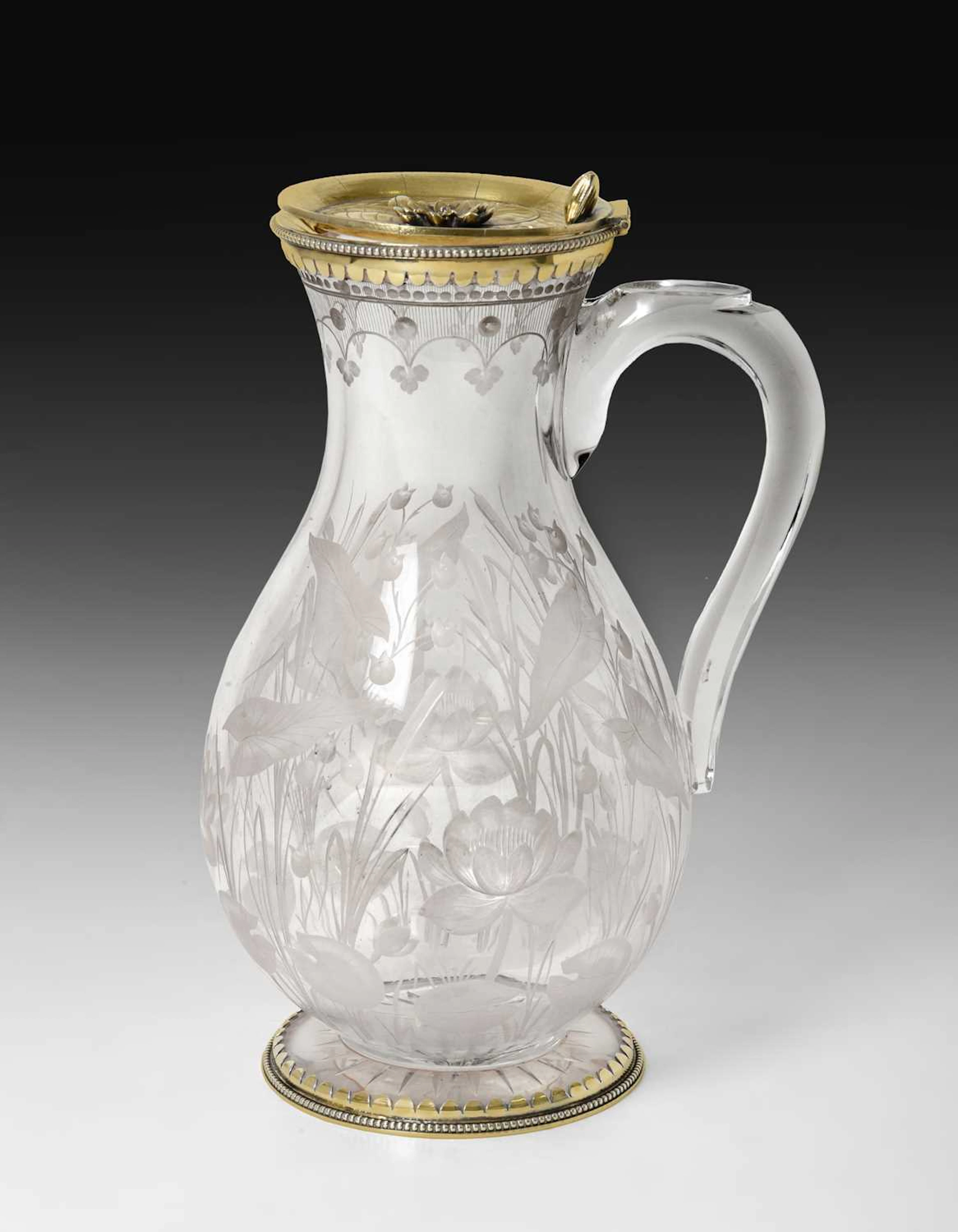 A Victorian Silver-Gilt Mounted Engraved Glass Claret-Jug The Silver