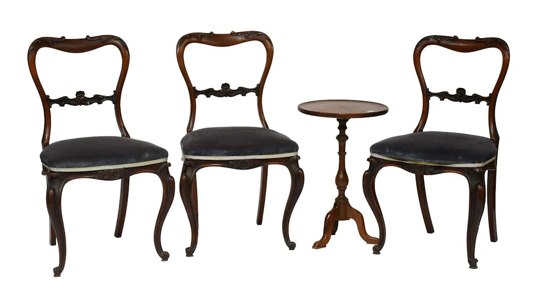 A Set of Three Victorian Carved Mahogany Balloon Back Dining Chairs