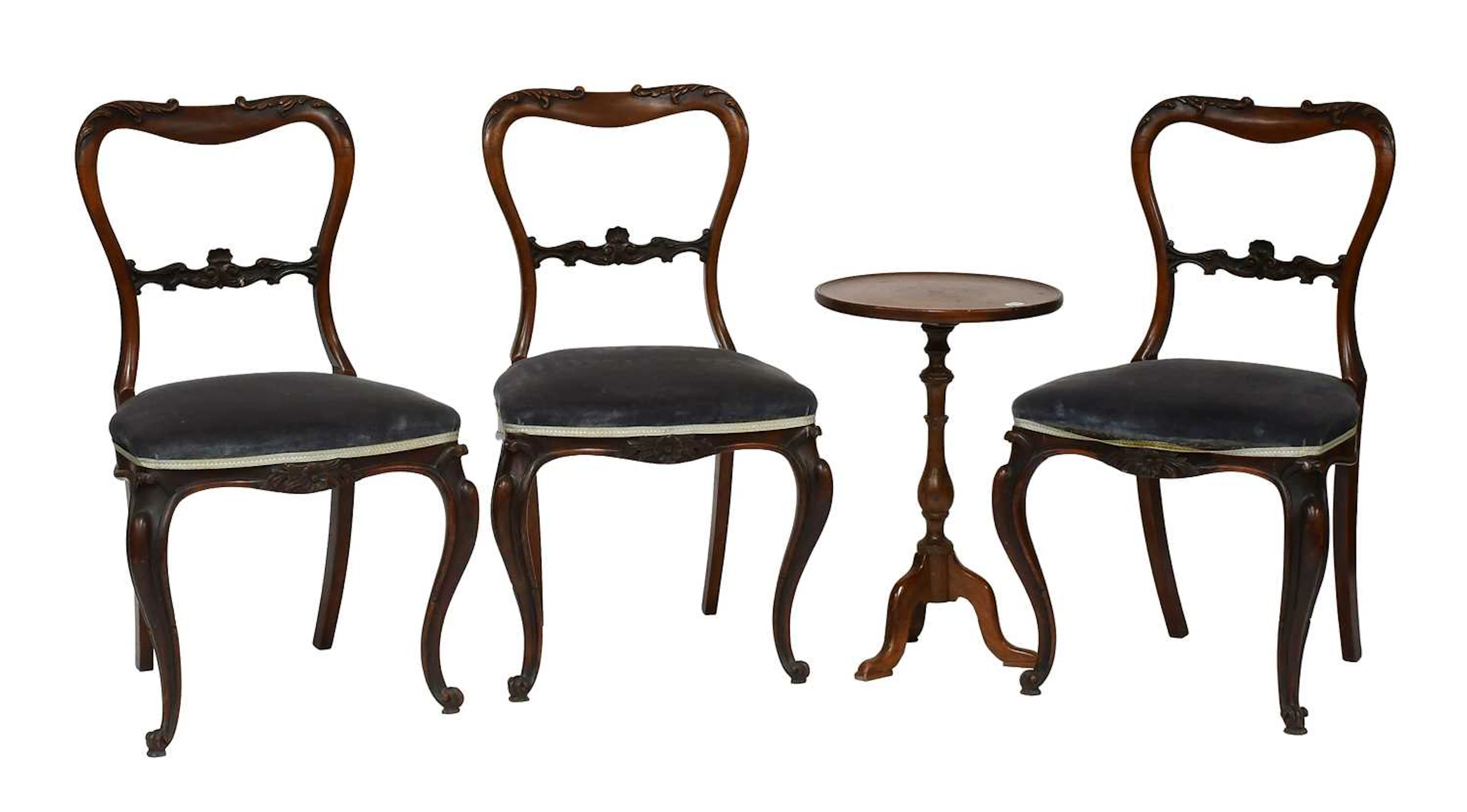A Set of Three Victorian Carved Mahogany Balloon Back Dining Chairs
