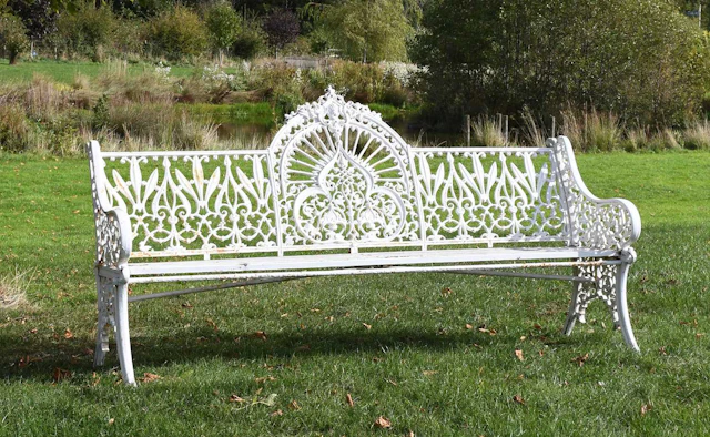 A Victorian Coalbrookdale Style Cast Iron Peacock Pattern Garden Bench